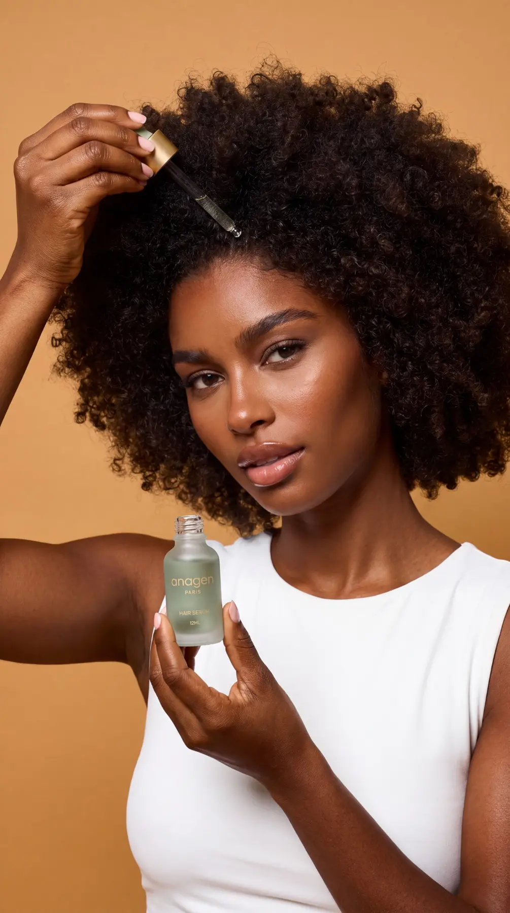 Model applying Anagen Paris Hair Serum